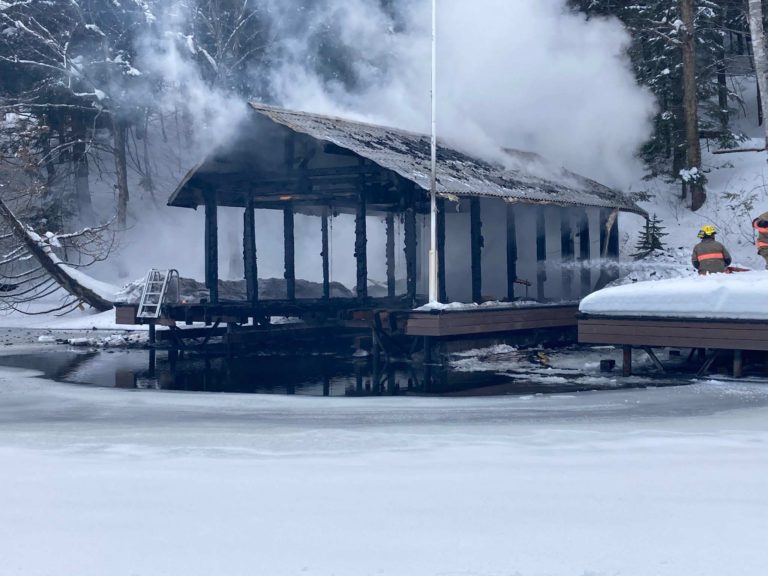 Firefighters needed snowmobiles to get to a flaming boathouse