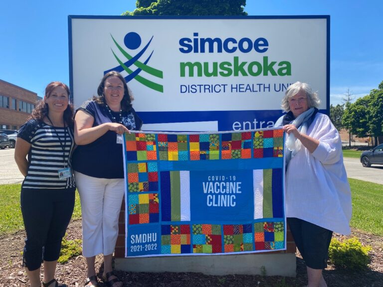 COVID-19 vaccination clinic volunteer donates handmade quilt to health unit
