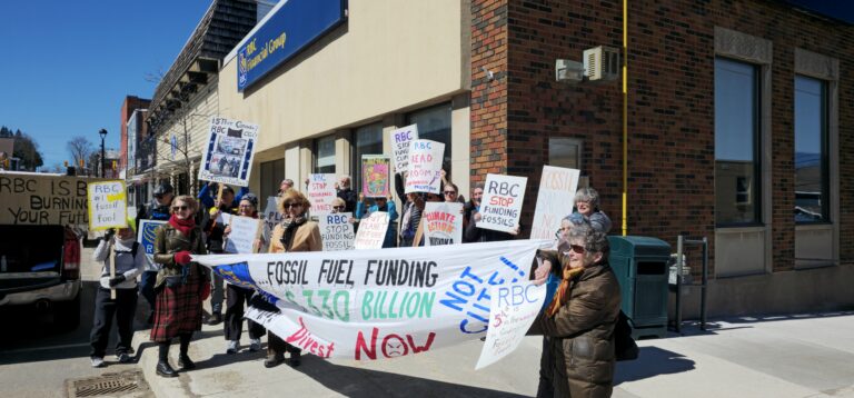 Group protests in front of ‘fossil fool’ bank in Huntsville